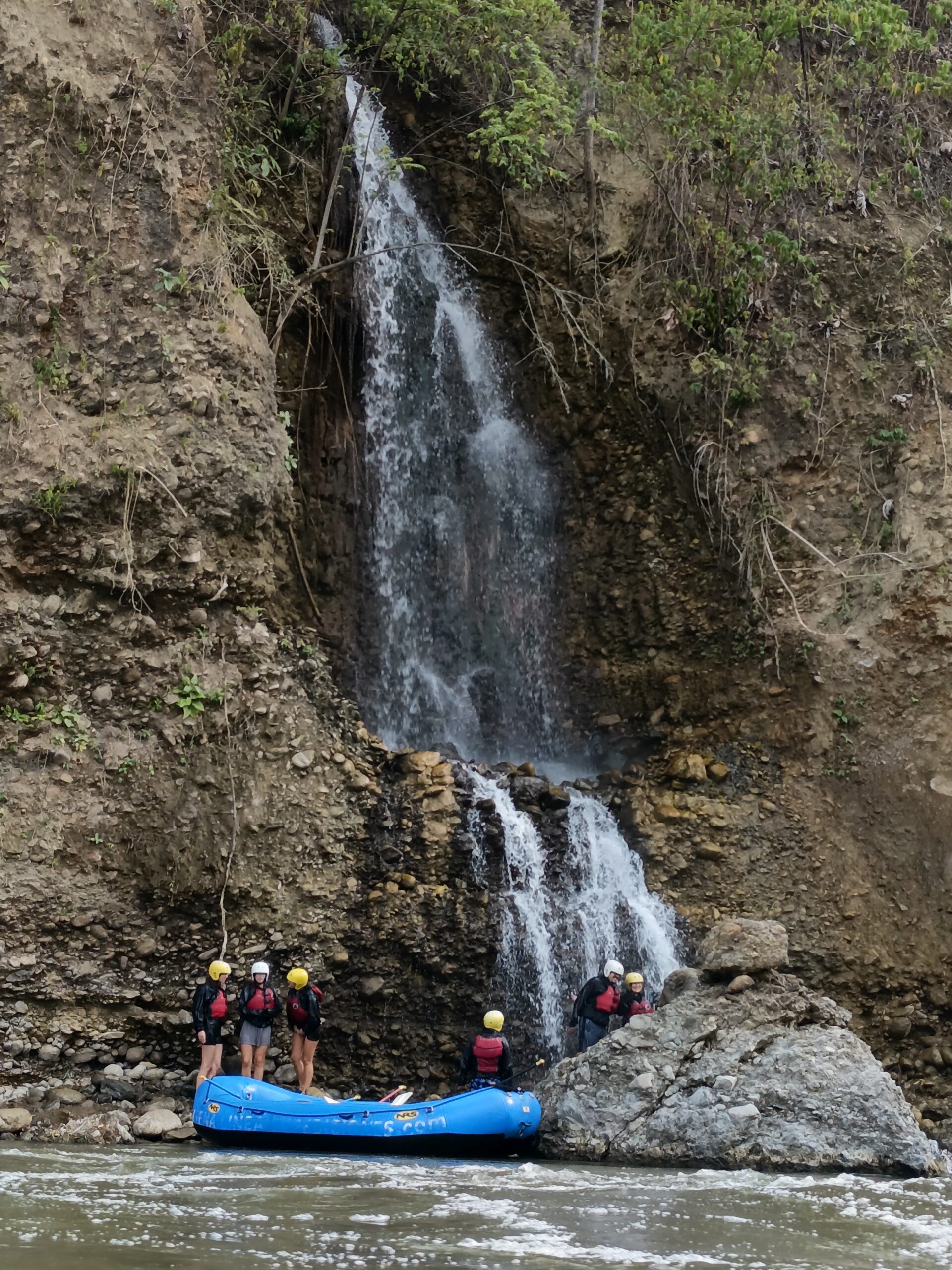 Rafting boat near waterfall in Santa María Urubamba River